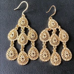 Gold colored metal tiered chandelier drop earrings